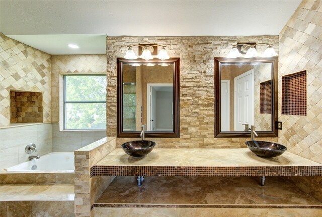 13727 Sablegarden Ln, Houston, TX 77014 - bathroom featuring a sink and a bath
