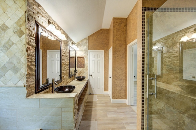 13727 Sablegarden Ln, Houston, TX 77014 - bathroom with vaulted ceiling, a stall shower, and double vanity