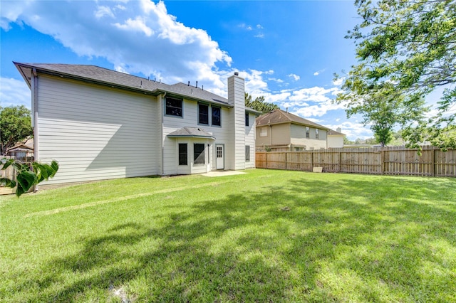 13727 Sablegarden Ln, Houston, TX 77014 - rear view of house with a chimney