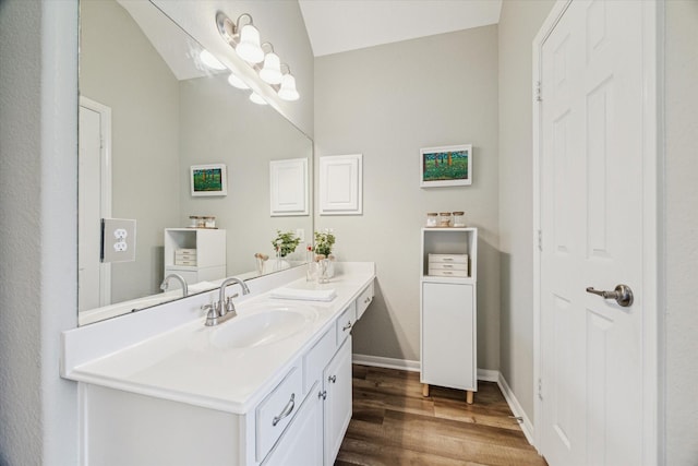 12427 Adams Ridge Ln, Humble, TX 77346 - bathroom featuring vanity, wood finished floors, and baseboards