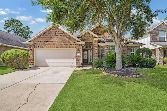 12427 Adams Ridge Ln, Humble, TX 77346 - traditional-style house featuring a garage, a front yard, brick siding, and driveway