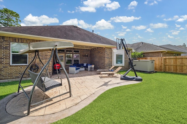 12427 Adams Ridge Ln, Humble, TX 77346 - rear view of house with brick siding, outdoor lounge area, a patio, and roof with shingles