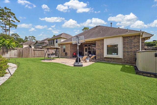 12427 Adams Ridge Ln, Humble, TX 77346 - back of property with a patio area, brick siding, and a shingled roof
