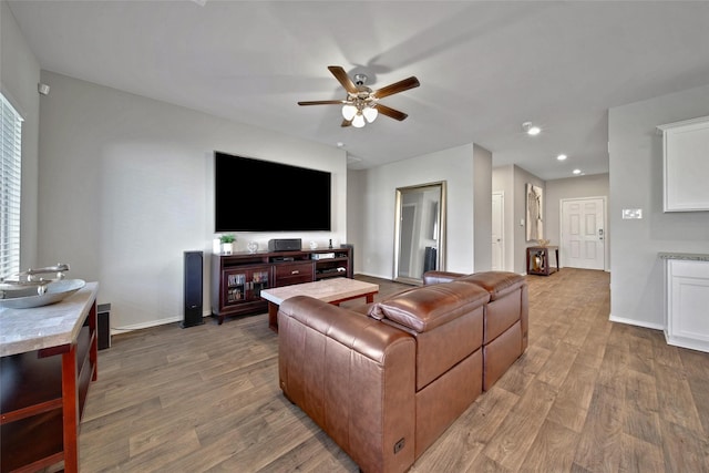 13854 Rock Island Trl, Conroe, TX 77384 - living room with wood finished floors, a ceiling fan, baseboards, and recessed lighting