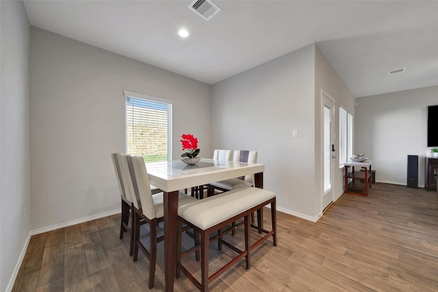 13854 Rock Island Trl, Conroe, TX 77384 - dining room with light wood-style flooring and baseboards