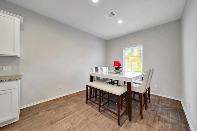13854 Rock Island Trl, Conroe, TX 77384 - dining room featuring light wood finished floors, baseboards, and recessed lighting