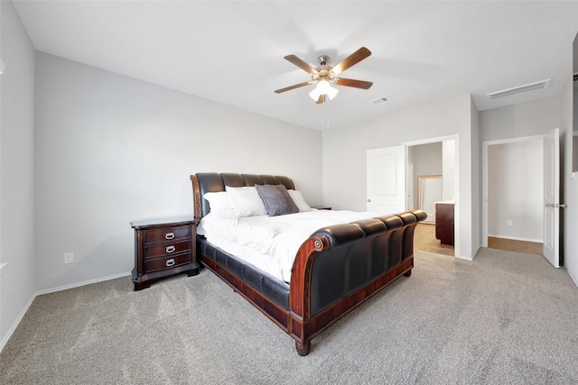 13854 Rock Island Trl, Conroe, TX 77384 - bedroom with light colored carpet, baseboards, and a ceiling fan