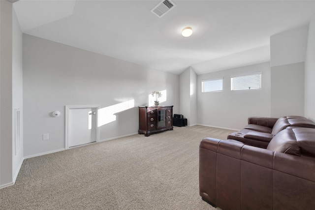 13854 Rock Island Trl, Conroe, TX 77384 - living area featuring light carpet, vaulted ceiling, and baseboards