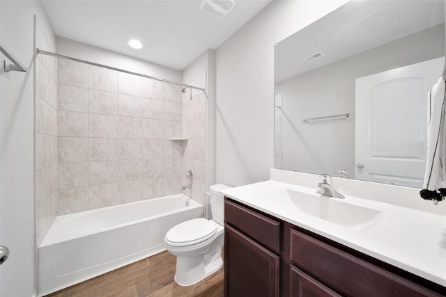 13854 Rock Island Trl, Conroe, TX 77384 - full bath featuring wood finished floors, toilet, vanity, and shower / washtub combination