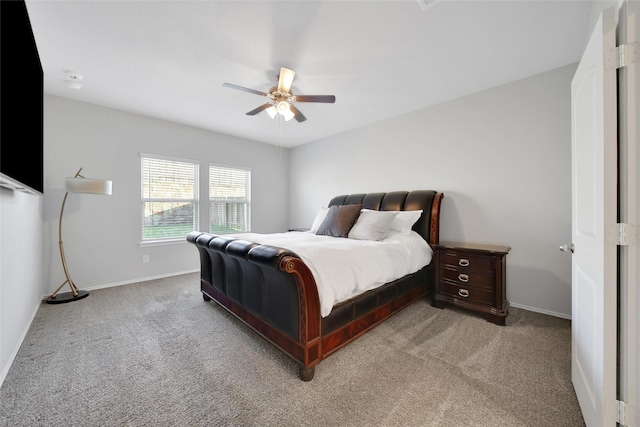 13854 Rock Island Trl, Conroe, TX 77384 - bedroom with light colored carpet, baseboards, and ceiling fan