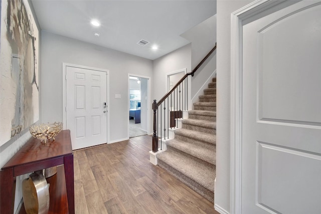 13854 Rock Island Trl, Conroe, TX 77384 - entrance foyer with stairway, wood finished floors, baseboards, and recessed lighting