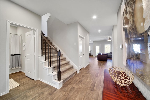 13854 Rock Island Trl, Conroe, TX 77384 - entrance foyer with wood finished floors, stairs, ceiling fan, recessed lighting, and baseboards