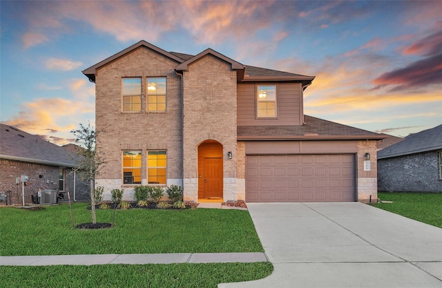 13854 Rock Island Trl, Conroe, TX 77384 - traditional-style home with driveway, a front yard, brick siding, and central AC