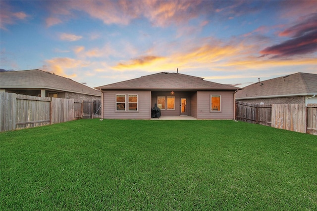 13854 Rock Island Trl, Conroe, TX 77384 - back of house at dusk with a patio area