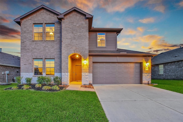 13854 Rock Island Trl, Conroe, TX 77384 - view of front of property with stone siding, driveway, a lawn, and brick siding