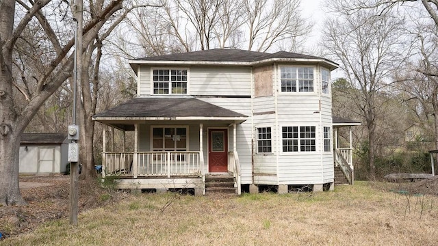 215 Wildwood Ln, Point Blank, TX 77364 - traditional-style house with a porch and a shingled roof