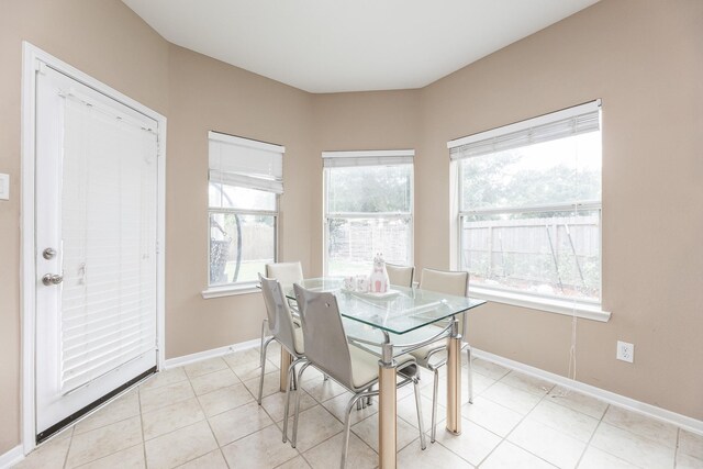 13422 Great Creek Dr, Pearland, TX 77584 - dining space with baseboards and light tile patterned floors