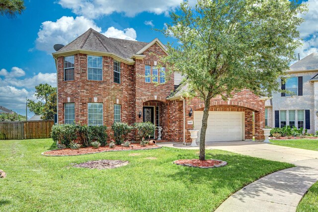 13422 Great Creek Dr, Pearland, TX 77584 - view of front of home with brick siding, concrete driveway, roof with shingles, and an attached garage
