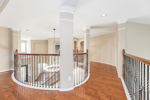 13422 Great Creek Dr, Pearland, TX 77584 - hall with an upstairs landing, ornate columns, wood finished floors, baseboards, and recessed lighting