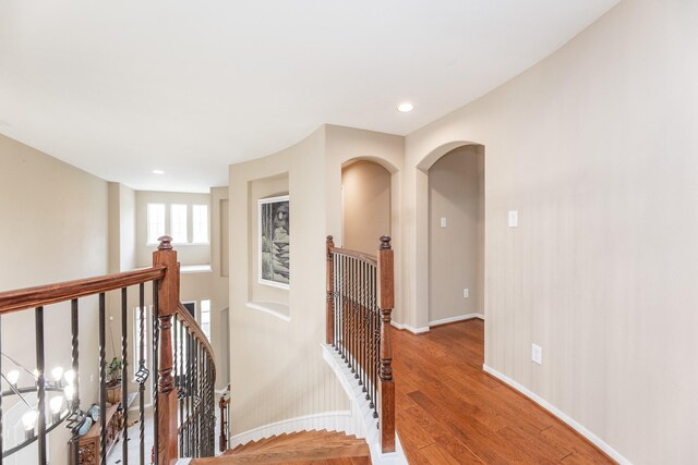 13422 Great Creek Dr, Pearland, TX 77584 - hall with an upstairs landing, wood finished floors, recessed lighting, and baseboards