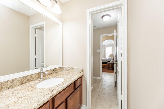 13422 Great Creek Dr, Pearland, TX 77584 - bathroom with vanity, tile patterned floors, and baseboards
