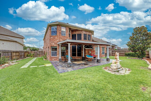 13422 Great Creek Dr, Pearland, TX 77584 - rear view of property with brick siding and a patio