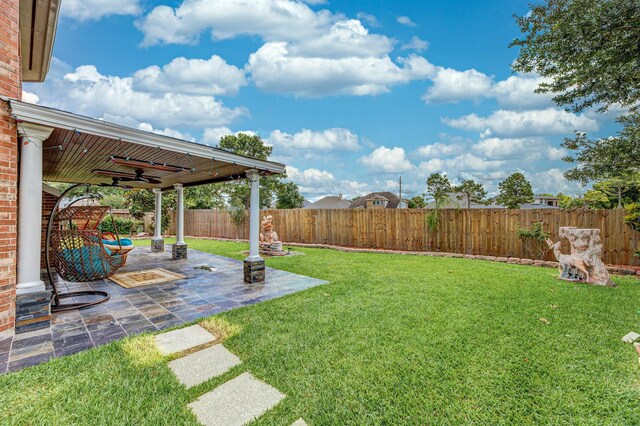 13422 Great Creek Dr, Pearland, TX 77584 - view of yard with ceiling fan and a patio area