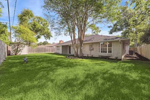 2007 Ottawa Ln, Houston, TX 77043 - rear view of property with central AC unit, a chimney, and brick siding
