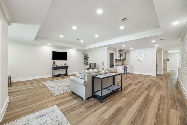2007 Ottawa Ln, Houston, TX 77043 - living area featuring a tray ceiling, light wood-style floors, baseboards, and recessed lighting
