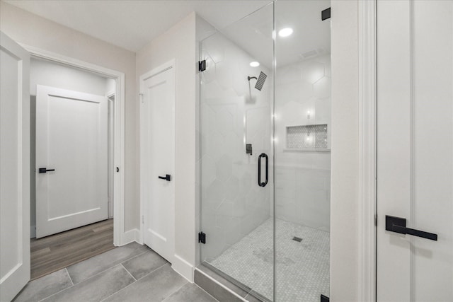 2007 Ottawa Ln, Houston, TX 77043 - bathroom featuring a shower stall, baseboards, recessed lighting, and tile patterned floors