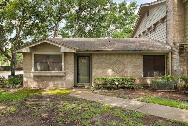 2711 Grants Lake Blvd Unit 144, Sugar Land, TX 77479 - view of front of house with brick siding and a shingled roof