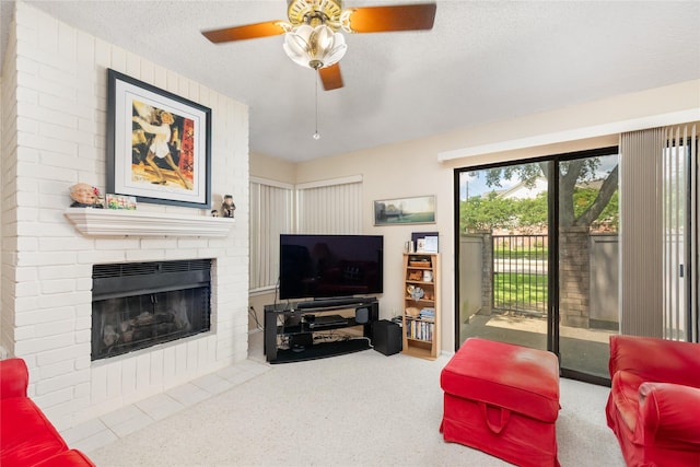 2711 Grants Lake Blvd Unit 144, Sugar Land, TX 77479 - carpeted living area featuring a brick fireplace, ceiling fan, and a textured ceiling
