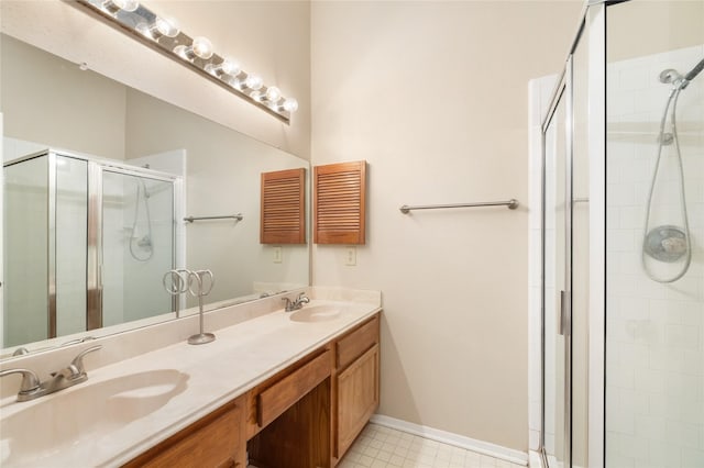 2711 Grants Lake Blvd Unit 144, Sugar Land, TX 77479 - bathroom with a shower stall, double vanity, and baseboards