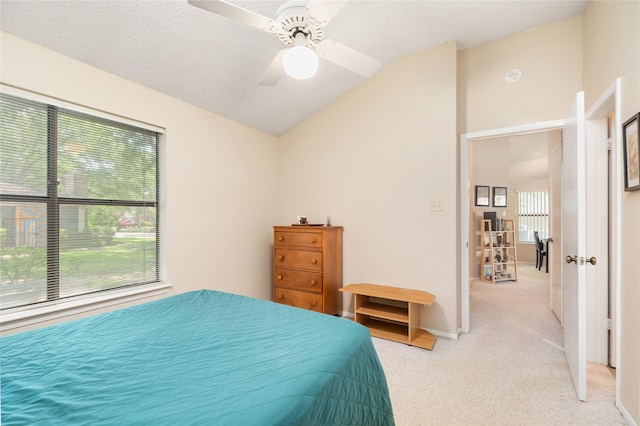 2711 Grants Lake Blvd Unit 144, Sugar Land, TX 77479 - bedroom featuring vaulted ceiling, light carpet, a ceiling fan, and baseboards