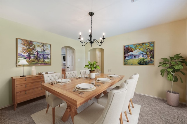 19426 Dolan Springs Dr, Tomball, TX 77377 - carpeted dining room featuring arched walkways, a chandelier, and baseboards