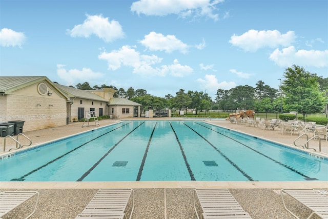 19426 Dolan Springs Dr, Tomball, TX 77377 - community pool with a patio