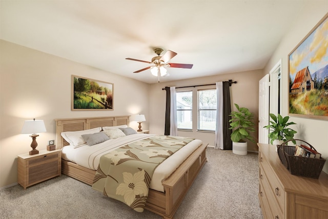 19426 Dolan Springs Dr, Tomball, TX 77377 - bedroom with light carpet, ceiling fan, and baseboards