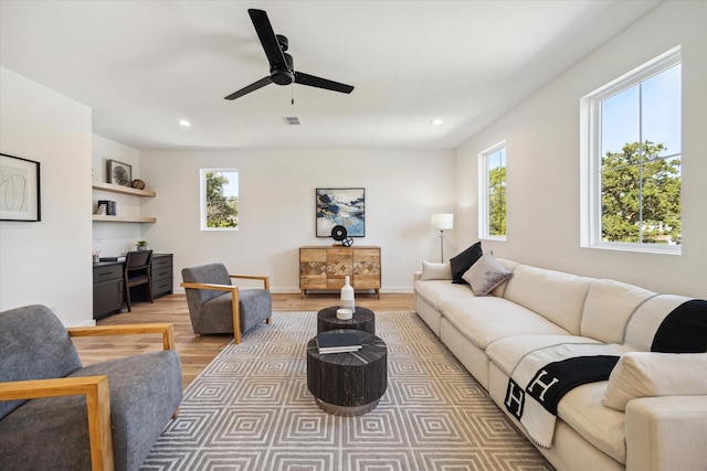 1707 Nina Lee Ln, Houston, TX 77018 - living room with light wood finished floors, recessed lighting, ceiling fan, and an office area