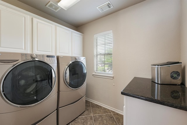 527 Oak Ridge Grove Cir, Spring, TX 77386 - washroom with separate washer and dryer, cabinet space, baseboards, and tile patterned flooring