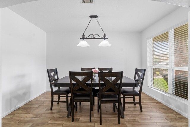 9931 Chimney Swift Ln, Conroe, TX 77385 - dining space with wood finished floors and baseboards