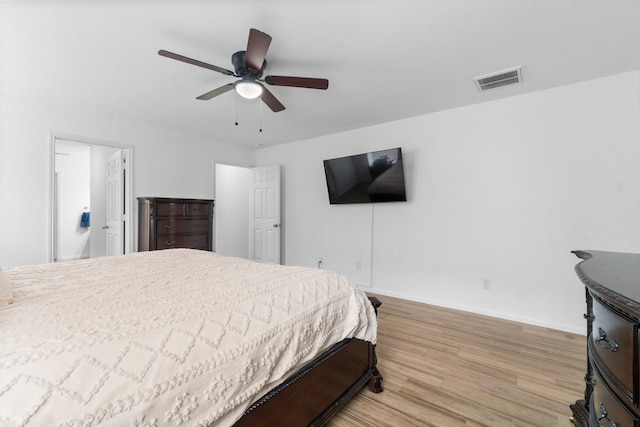 9931 Chimney Swift Ln, Conroe, TX 77385 - bedroom featuring light wood finished floors, baseboards, and ceiling fan