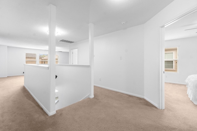 9931 Chimney Swift Ln, Conroe, TX 77385 - hall featuring carpet, an upstairs landing, and plenty of natural light