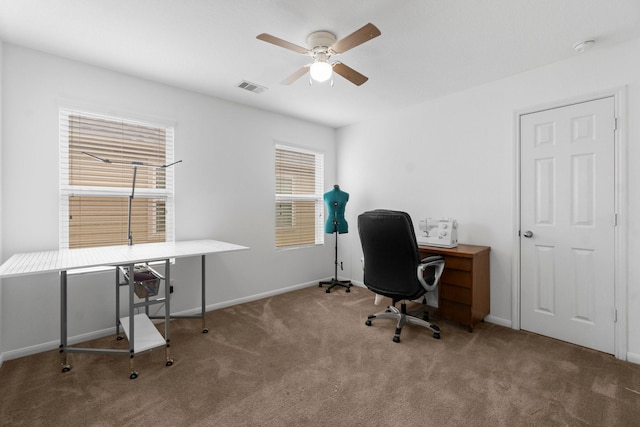 9931 Chimney Swift Ln, Conroe, TX 77385 - home office featuring a ceiling fan, carpet floors, and baseboards
