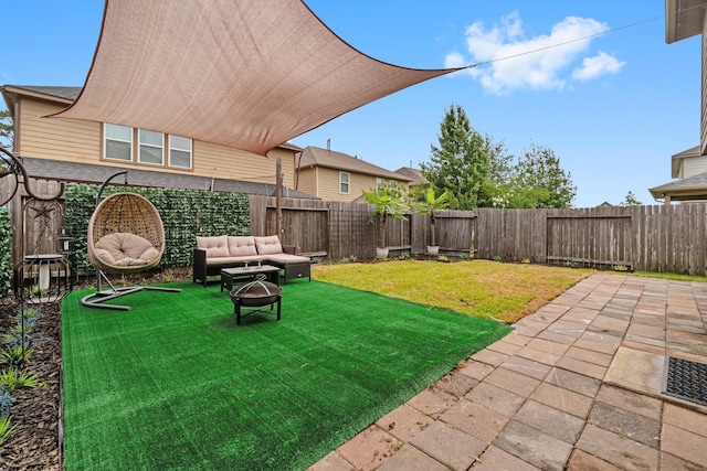 9931 Chimney Swift Ln, Conroe, TX 77385 - view of yard with a patio and an outdoor living space with a fire pit