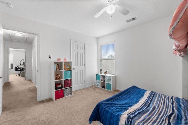 9931 Chimney Swift Ln, Conroe, TX 77385 - carpeted bedroom with attic access, baseboards, and a ceiling fan