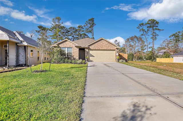 187 Deer Lake Rd, Huffman, TX 77336 - single story home featuring driveway, an attached garage, and brick siding