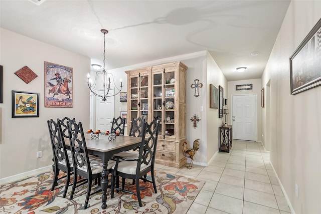 187 Deer Lake Rd, Huffman, TX 77336 - dining area with a chandelier, light tile patterned floors, and baseboards