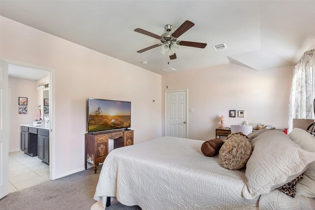 187 Deer Lake Rd, Huffman, TX 77336 - bedroom featuring ceiling fan, ensuite bath, light carpet, and light tile patterned flooring