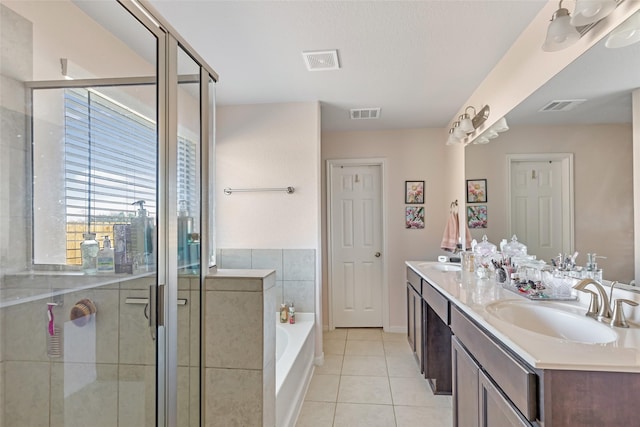 187 Deer Lake Rd, Huffman, TX 77336 - bathroom with double vanity, a garden tub, tile patterned flooring, and a shower stall