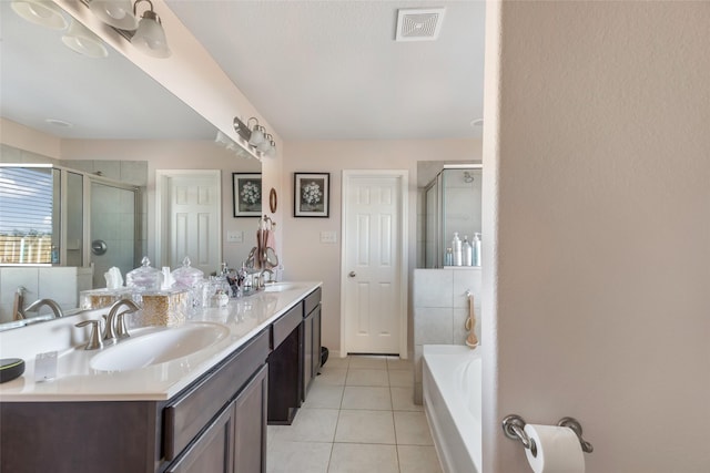 187 Deer Lake Rd, Huffman, TX 77336 - full bathroom with double vanity, a stall shower, tile patterned floors, and a bath